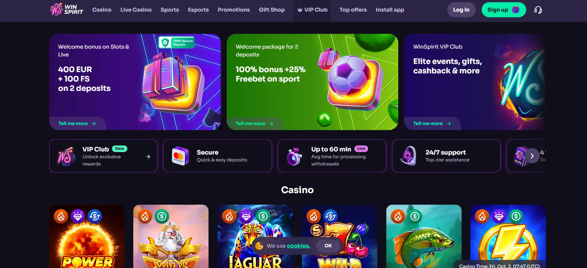 Laptop and phone displaying a neutral casino lobby beside payment cards and crypto symbols